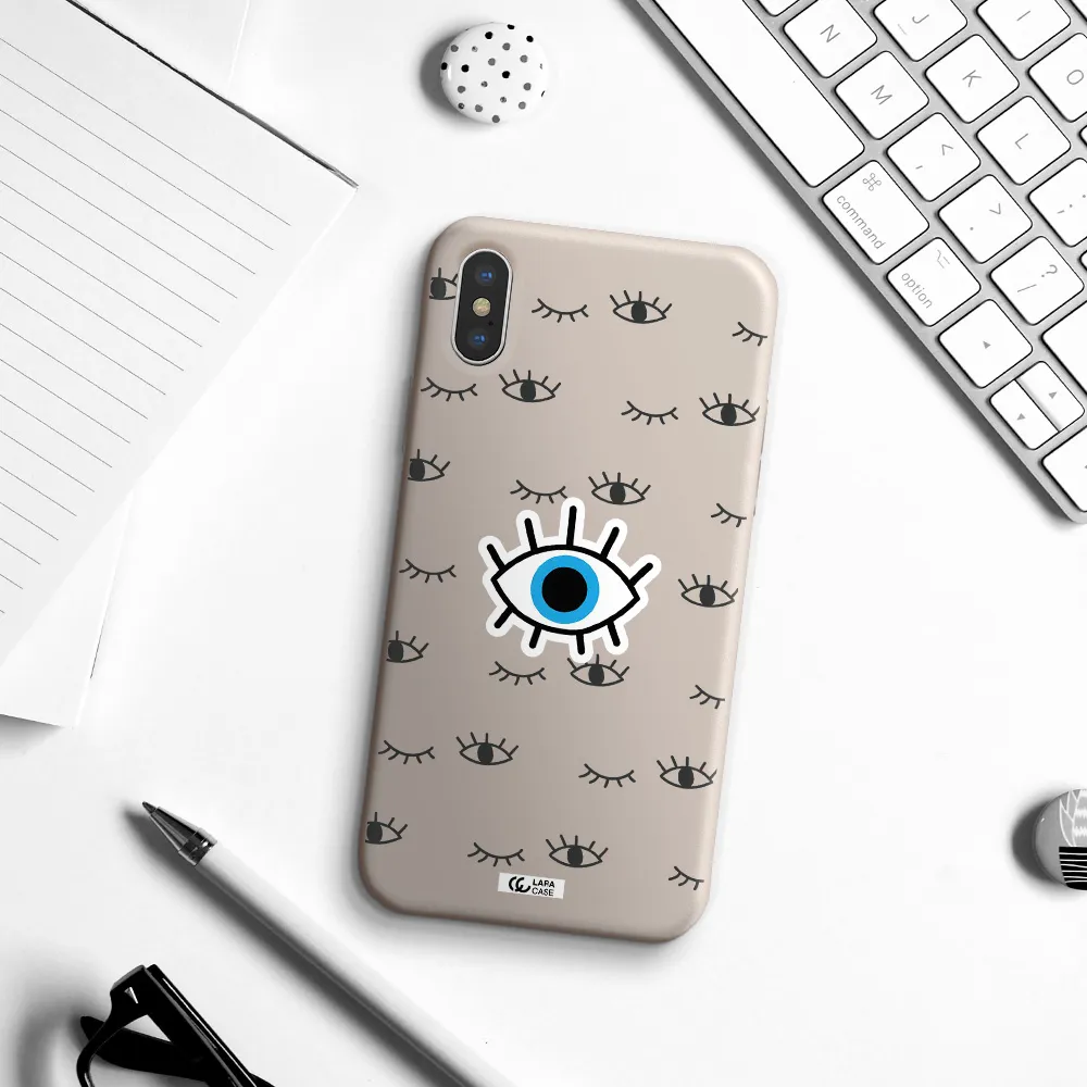 a blue eye with black eyeballs and eyelashes Apple iPhone XS Silicone Stone Case
